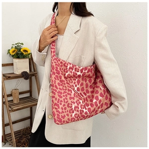 Close-up of pink leopard print canvas tote bag with large capacity and fixed shoulder strap