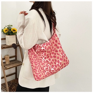 Chic pink leopard print tote bag styled with a white blazer for a casual autumn outfit