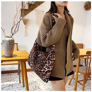 Detail of leopard print canvas tote bag showing its large capacity and thick shoulder strap