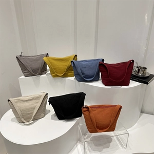 Minimalist canvas tote bag available in seven trendy colors including grey yellow and red