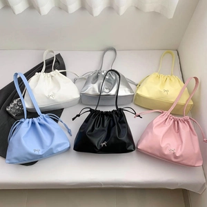 Chic drawstring tote bags for women in various colors shown from a high angle view