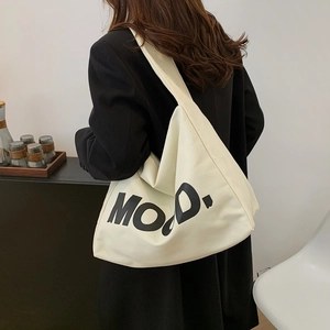 Minimalist canvas tote bag with MOOD lettering for casual everyday shoulder carry