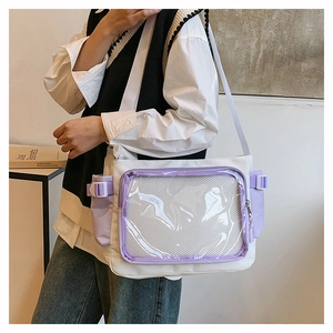 Detail view of white canvas crossbody bag with clear window and purple accents for display