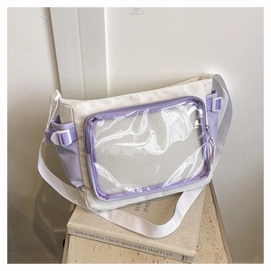 Detail of the white and purple canvas ita-bag featuring a transparent PVC grid pocket