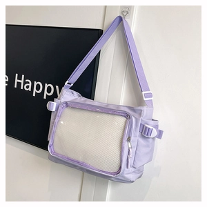 Detail of lavender crossbody bag with transparent display window and adjustable strap