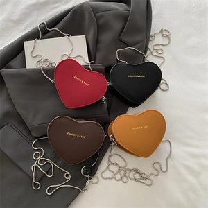 Minimalist heart-shaped crossbody bags in four colors with gold chain straps and PU leather