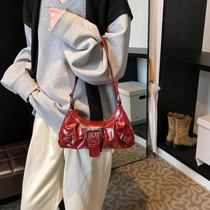 Retro burgundy faux leather baguette bag with oversized silver metal buckle in hobo style