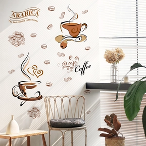 Detail of coffee cup wall stickers and Arabica lettering in a bright sunlit kitchen scene