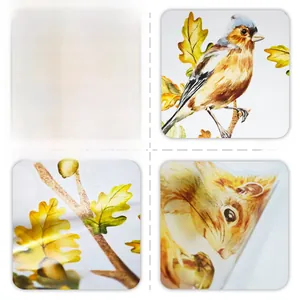 Macro shot of squirrel and bird wall stickers showing high gloss finish and material texture