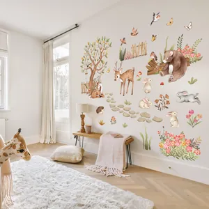 Detail of bohemian woodland animal wall decals in a minimalist Nordic nursery setting