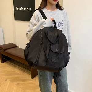 Versatile black waterproof nylon backpack for travel showing high-capacity design and texture