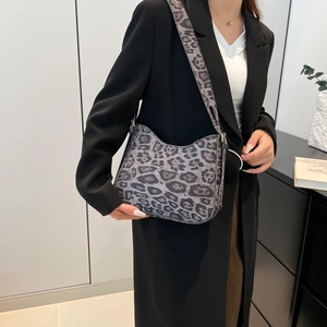 Modern grey leopard print shoulder bag for women with wide strap and sleek curved design