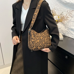 Stylish leopard print hobo shoulder bag for women with wide strap worn with black blazer