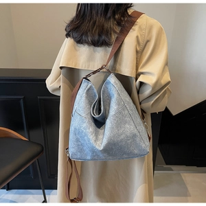 Detailed back view of a dark grey oversized tote bag with brown fabric shoulder strap