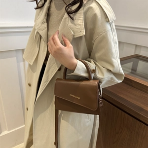 Minimalist coffee brown rectangle handbag with asymmetrical flap and top handle