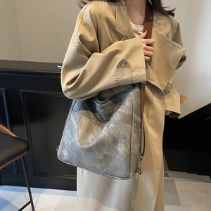 Large distressed grey hobo tote bag with wide strap for urban commuting style