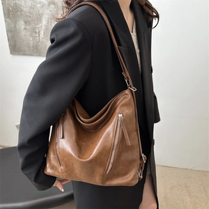 Retro deep brown large capacity hobo shoulder bag with zipper details and soft leather texture