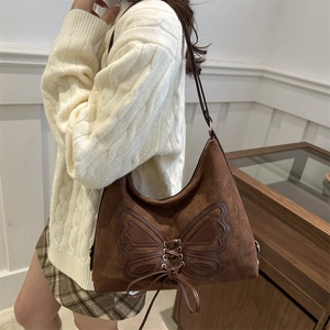 Retro dark brown suede tote bag featuring a large butterfly design and tie-up detail