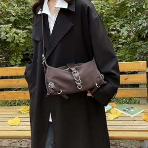 Vintage brown nylon crossbody shoulder bag with silver hardware for women in outdoor setting