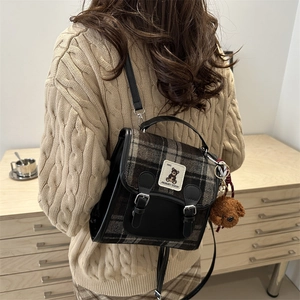 Retro Scottish plaid backpack with leather trim and cute teddy charm in lifestyle setting