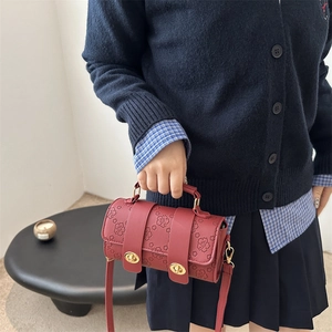 Vintage dark red cherry blossom embossed barrel bag with gold buckles and shoulder strap