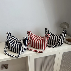 Three striped canvas tote bags in blue, red, and black stripes for daily commute