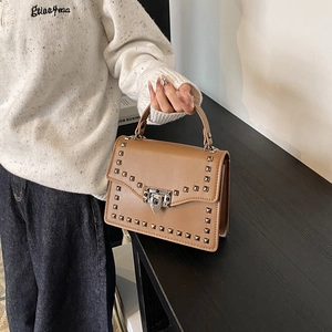 Brown rivet leather shoulder bag with silver hardware and chic square design