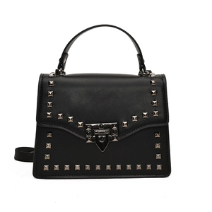 Black chain shoulder bag with silver studs and metal buckle on white background