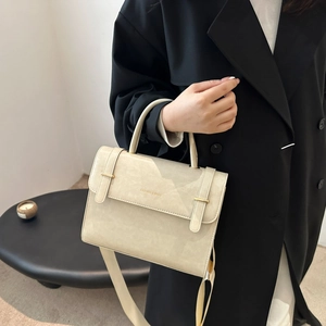 Minimalist cream white crossbody handbag for women with metallic buckles and logo detail