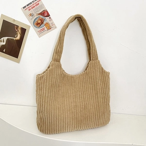 Minimalist khaki corduroy tote bag with vertical stripes on white aesthetic background