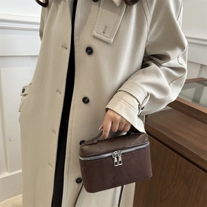 Minimalist brown patchwork leather bucket handbag with stylish dual zippers for women