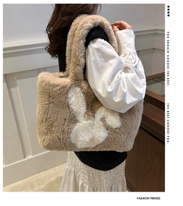 Close-up of fluffy faux fur tote bag with cute rabbit pattern for autumn winter