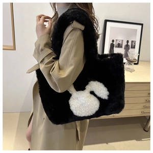 Close-up of plush tote bag with white bunny patch and soft faux fur texture