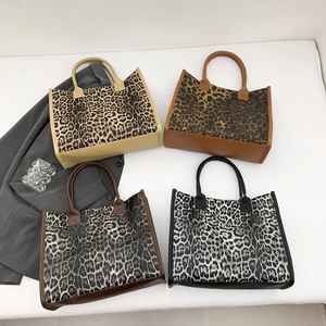 Fashionable leopard print tote bags in four colors with leather handles and chic design