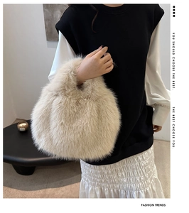 Detail of soft beige faux fur handbag paired with a minimalist autumn fashion outfit
