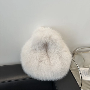 Chic light gray fluffy faux fur handbag with sleek integrated top handle for winter