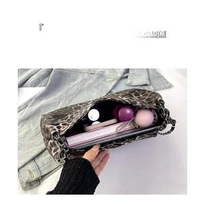 Detailed internal view of large leopard print tote bag showing spacious storage capacity