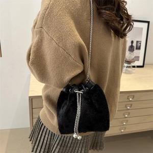 Fashionable black faux fur bucket bag with silver chain and bead drawstring detail
