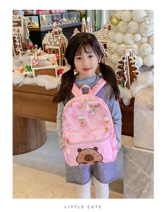 Detailed view of kids' pink Capybara cartoon backpack with durable zipper and straps