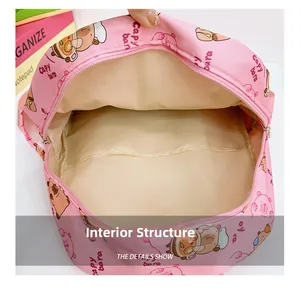 Internal structure of the pink cartoon backpack showing fabric lining and open pocket