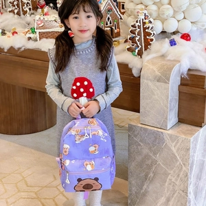 Cute purple capybara cartoon backpack for kids with lightweight straps in festive setting