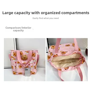 Pink canvas tote bag featuring cute capybara patterns and large internal storage capacity