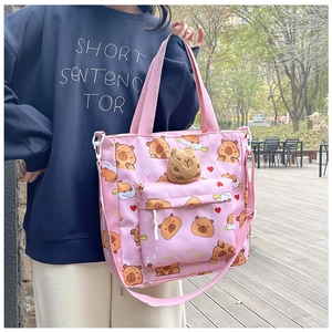 Pink canvas tote bag featuring cute capybara print and 3D plush charm with zipper pocket