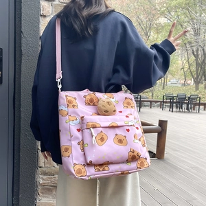Pink Capybara canvas crossbody bag with plush charm and cute cartoon patterns