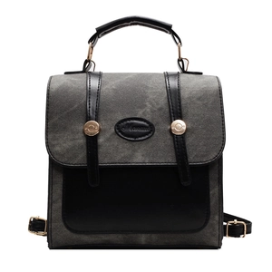 British style grey patchwork backpack with black leather straps and metal buckles
