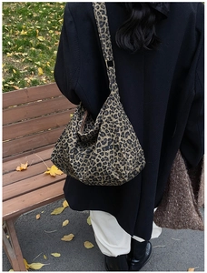 Close-up of leopard print canvas tote bag showing thick texture and spacious interior