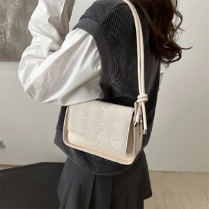 Chic beige textured small square bag with woven flap and stylish knot shoulder strap detail