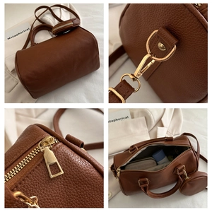 Detailed views of brown Boston bag showing gold hardware, zipper, and interior space