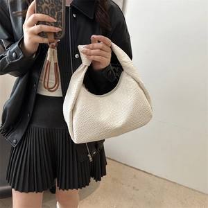 Chic woven ivory hobo bag with knotted handle for women, elegant woven shoulder bag design