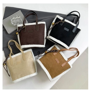 Detailed group shot of suede tote bags with lamb wool trim and fashion label